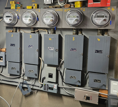 Before: old fuse panels and meters